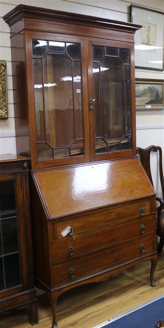 An Edwardian inlaid mahogany bureau bookcase W.107cm, H.215cm
